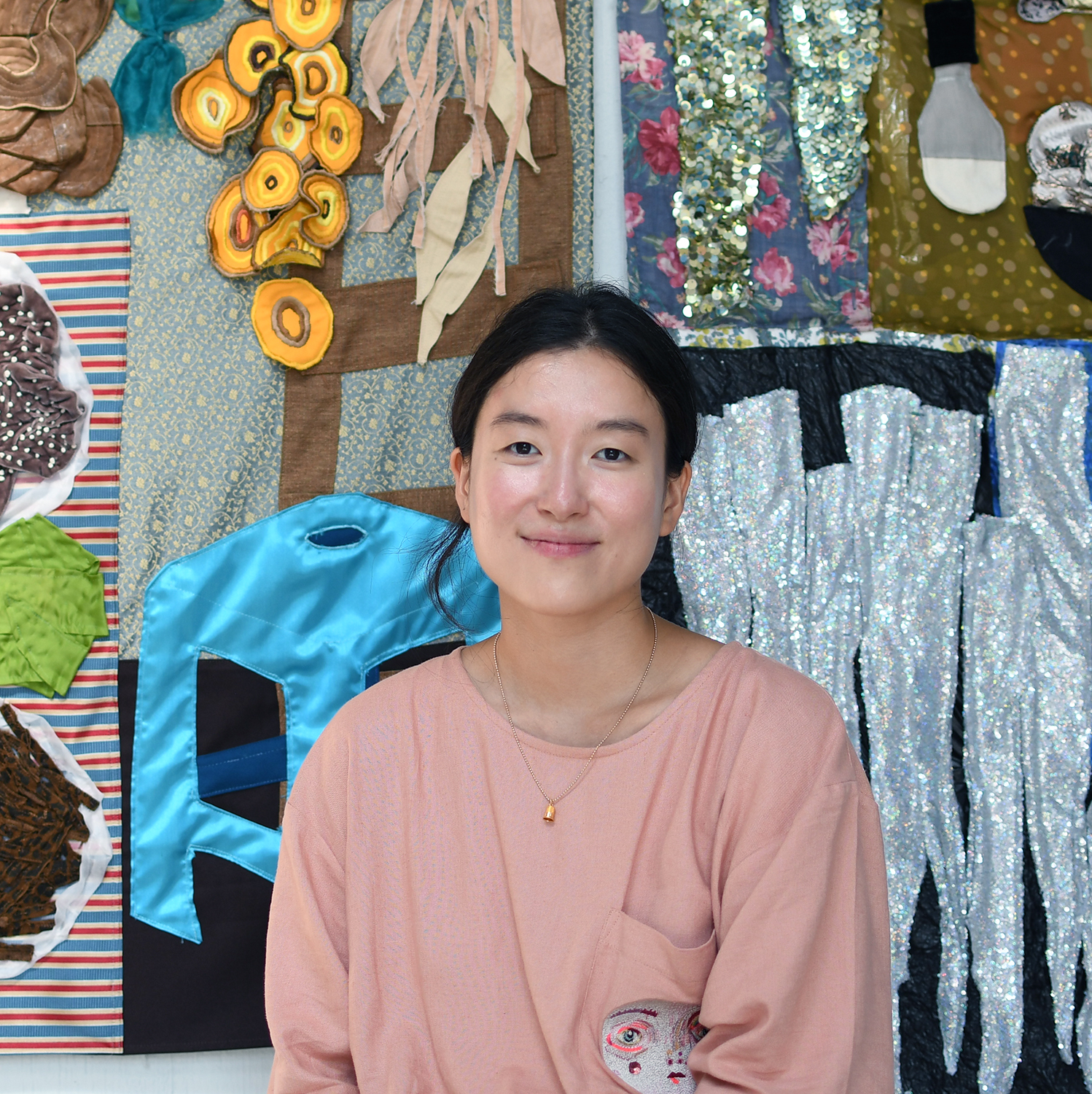 Woomin Kim with her works